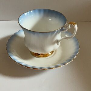 Vintage Royal Albert Rainbow tea cup and saucer blue and gold.